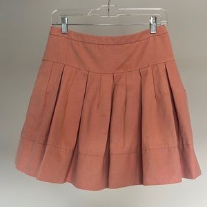 Small pleated skirt with pockets